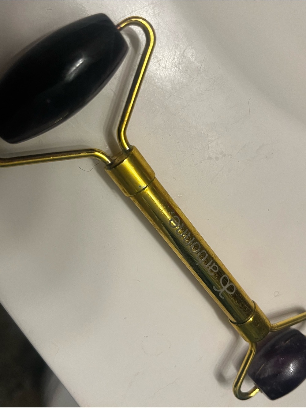 Arbonne Gold Facial Roller with purple Stone Heads